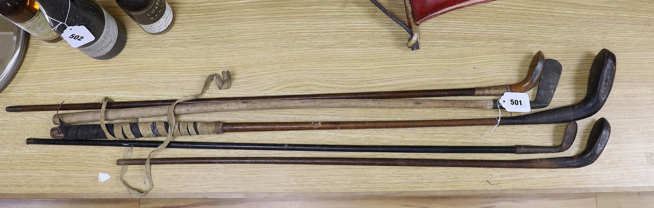 Three Sunday sticks, a dognose club and other golf clubs